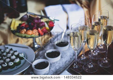 Beautifully Luxury Decorated Catering Banquet Table With Black And Red Caviar And Different Food Sna