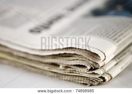 newspaper stack on white background