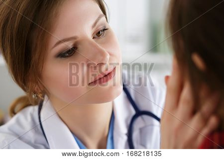 Female Medicine Doctor Examining Patient