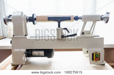 Woodworking Machine, Mini Woodworking Lathe Close Up Detail, Wood Shavings Tools, Woodworking Machinery, Small Woodwork Lathe in a Joinery Workshop, Woodwork on the Machine, Spindle Turning