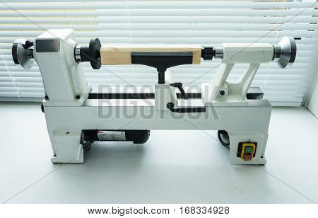 Woodworking Machine, Mini Woodworking Lathe Close Up Detail, Wood Shavings Tools, Woodworking Machinery, Small Woodwork Lathe in a Joinery Workshop, Woodwork on the Machine, Spindle Turning