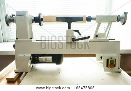 Woodworking Machine, Mini Woodworking Lathe Close Up Detail, Wood Shavings Tools, Woodworking Machinery, Small Woodwork Lathe in a Joinery Workshop, Woodwork on the Machine, Spindle Turning