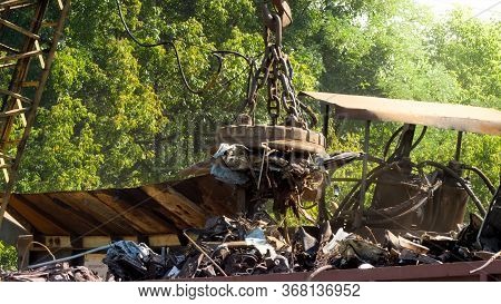 Big Electric Magnet Sorting Metal Waste From Other Rubbish On Scrapyard