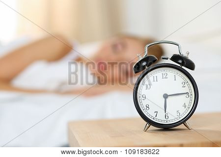 Alarm Clock Standing On Bedside Table Going To Ring Early Morning