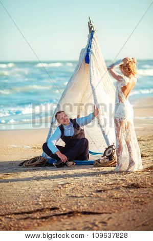 Bride and groom on their wedding day on the beach
** Note: Shallow depth of field