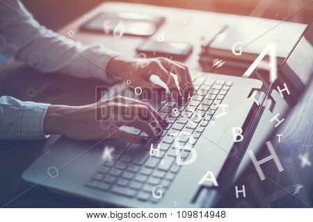 Working at home with laptop woman writing a blog. Female hands on the keyboard