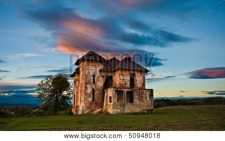 Old abandoned haunted house and sky in Transylvania with clouds.Abandoned mansion in ruins