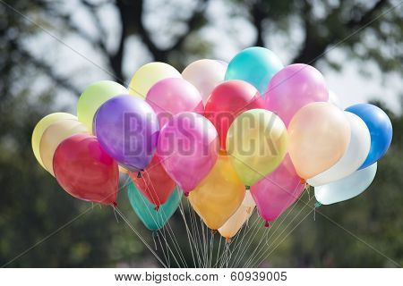 multicolored balloons and confetti in the city festival