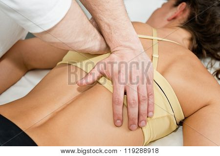 Chiropractor Treating Patient