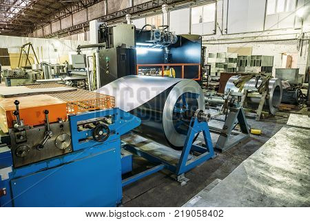 Industrial factory with equipment tools in large workshop or warehouse, manufacturing and steel works, industrial background