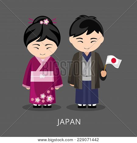 Japanese In National Dress With A Flag. Man And Woman In Traditional Costume. Travel To Japan. Peopl