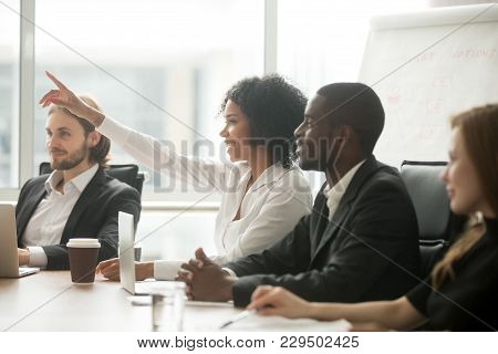 African Woman Raising Hand To Ask Question At Team Training, Curious Black Employee Or Conference Se