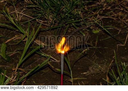 Fourth Of July Sparkler With Ground Back Ground