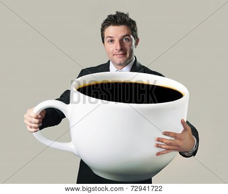 Happy Businessman Holding Funny Huge  Oversized Cup Of Black Cof