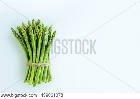 Asparagus In A Bunch On A White Background.asparagus For Sale In A Store.young Juicy Asparagus For C