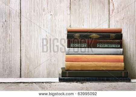 Old Book Shelf Blank Spines, Empty Binding Stack On Wood Texture Background, Knowledge Concept