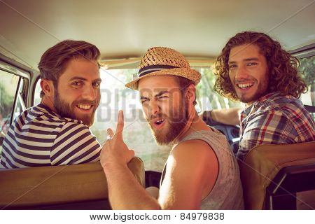 Hipster friends on road trip on a summers day