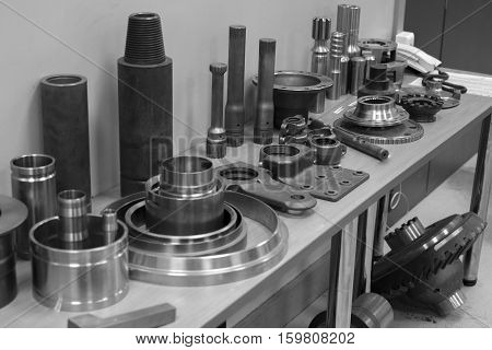 Industrial lathe tool and high precision cnc turning parts. high precision automotive machining mold and die part. CNC prosessed parts on table.