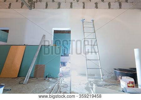 Working Process Of Installing Plasterboard Or Drywall For Making Gypsum Walls In Apartment Is Under 