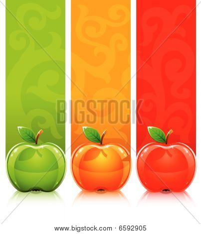 Three Coloured Apples On Decorative Background