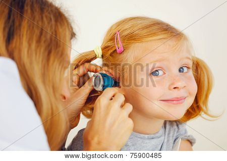 Pediatrician Doctor Examining Little Girl Ears.