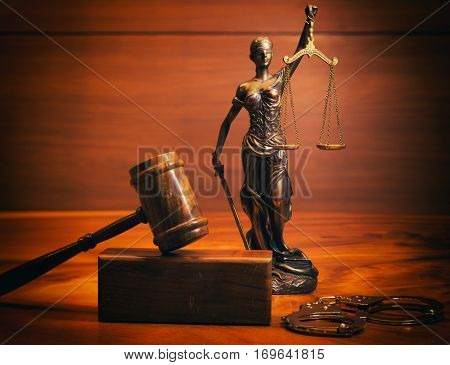 Burden of proof - legal law concept image with Scales of justice and row of law books in background. Hazy light from right good for text copy.