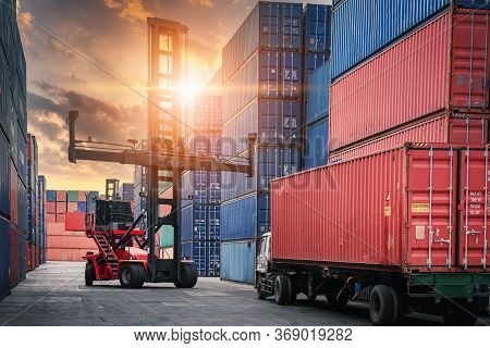 Container Cargo Port Ship Yard Storage Of Logistic Transportation Industry. Forklift Is Stacking Con