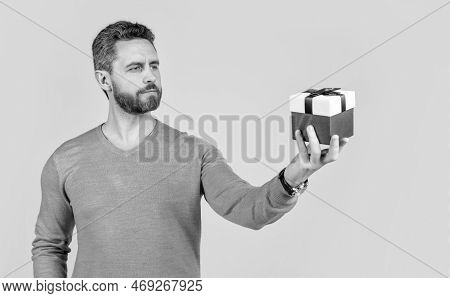 Handsome Mature Man With Beard Holding Present Box, Womens Day