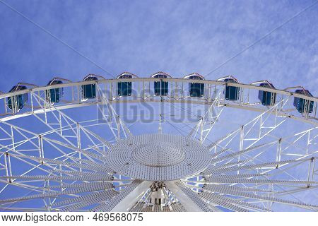 Ferris Wheel On The Background Of The Sky View From Below