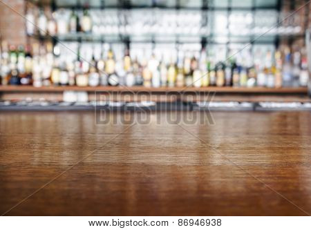 Top Wooden Table With Bar Blurred Background