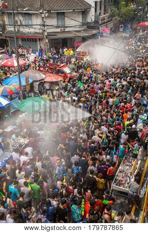 Bangkok, Thailand - April 13, 2014 : The Songkran festival or Thai New Year's festival on Silom street in Bangkok, Thailand.