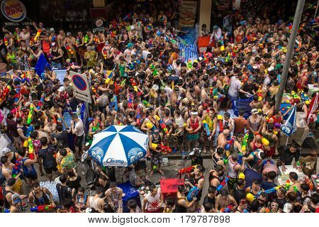 Bangkok, Thailand - April 13, 2014 : The Songkran festival or Thai New Year's festival on Silom street in Bangkok, Thailand.