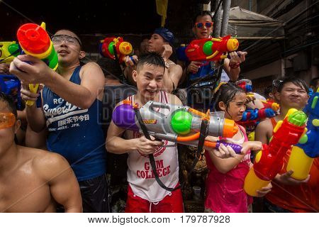 Bangkok, Thailand - April 13, 2014 : The Songkran festival or Thai New Year's festival on Silom street in Bangkok, Thailand.