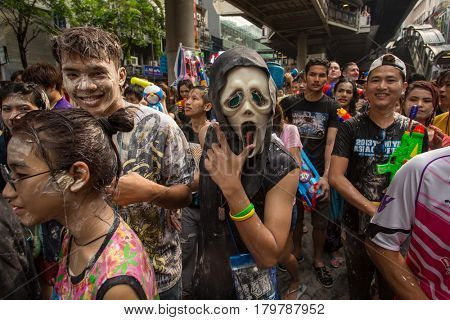 Bangkok, Thailand - April 13, 2014 : The Songkran festival or Thai New Year's festival on Silom street in Bangkok, Thailand.