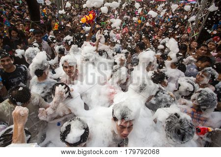 Bangkok, Thailand - April 13, 2014 : The Songkran festival or Thai New Year's festival on Silom street in Bangkok, Thailand.