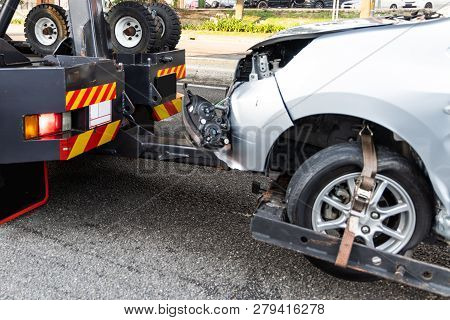 Tow Truck Towing Broken Down Car From Accident On Road