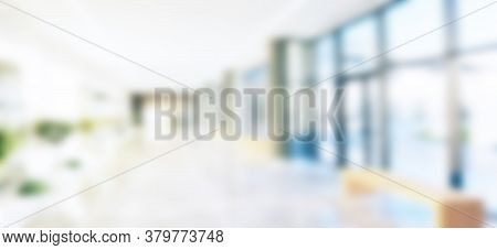 Blurred Office Background. Modern Space. Blur Image Background Of Corridor In Hospital Or Office Ima