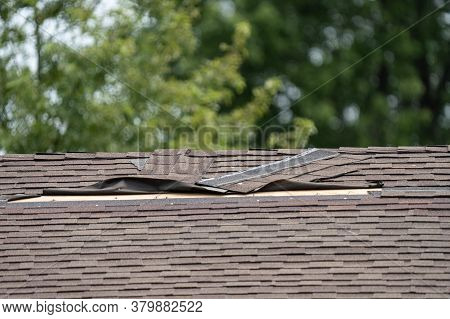 Roof Shingles Have Been Damaged By Heavy Winds And Strong Storms