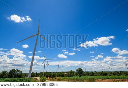 Landscape Of Windmills For Electric Power Production With White Cloud And Blue Sky At Huai Bong, Dan