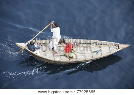 Residents of Dhaka cross Buriganga river by boat  in Dhaka, Bangladesh.