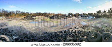 Wide Angle View Of Piles Of Tires And Other Trash (rubbish) At The Abandoned Furber's Scrapyard In S