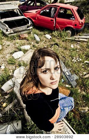 Young woman in the scrapyard