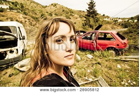 Young woman in the scrapyard