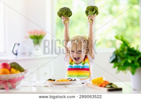 Baby Eating Vegetables. Solid Food For Infant.