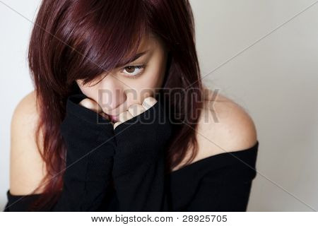 Beautiful redhead sad teen, isolated on white.