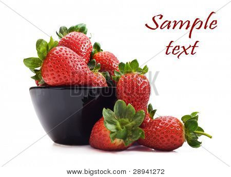 Healthy fresh strawberries and a bowl on a pure white background with space for text