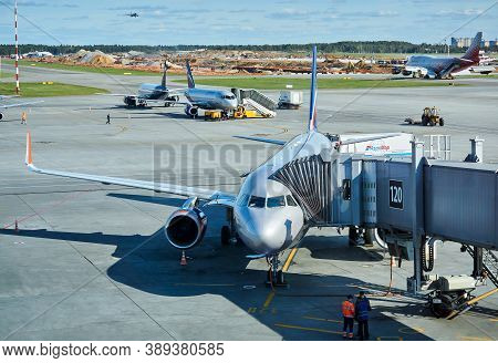 Moscow, Russia - September 16, 2020: Boarding Passengers On A Plane Using A Jet Bridge At Sheremetye