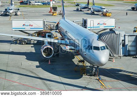 Moscow, Russia - September 16, 2020: Boarding Passengers On A Plane Using A Jet Bridge At Sheremetye