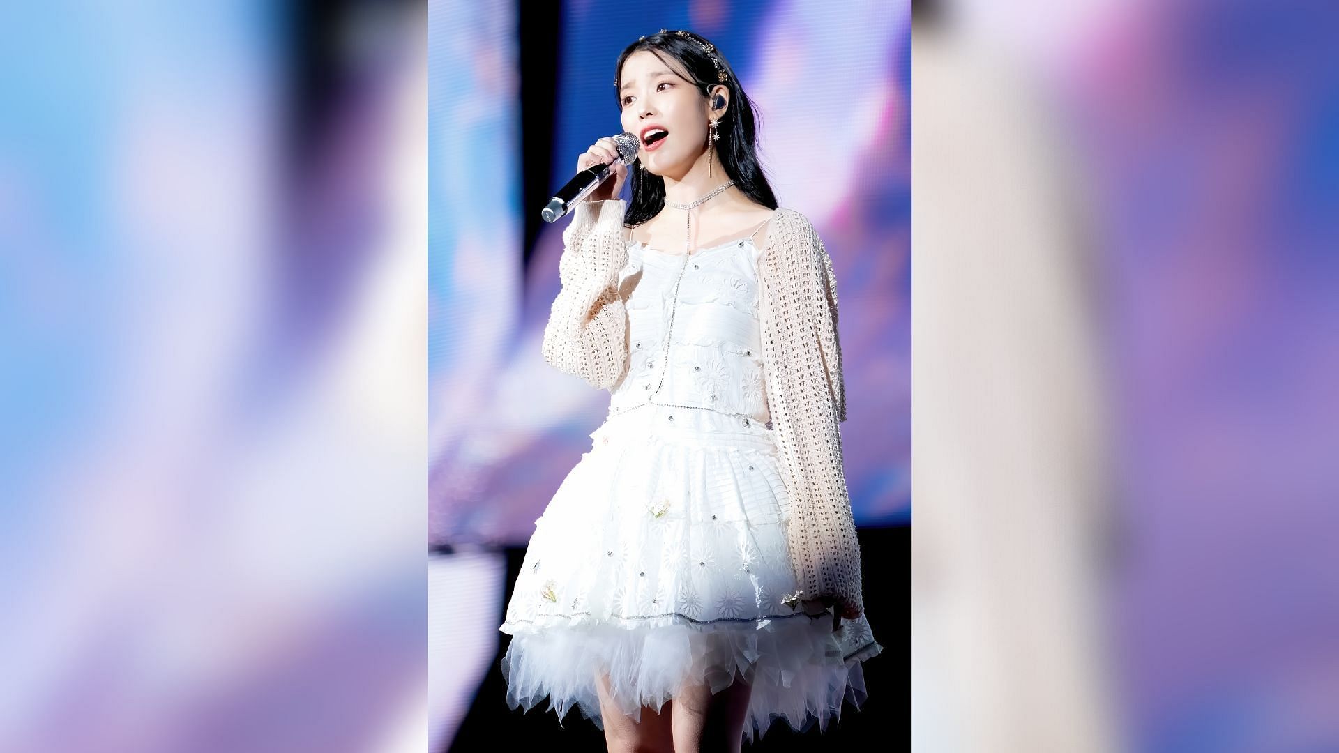 Jieun looking ethereal in a white mini-dress with lace ruffles (Image via Twitter/UAENA_KiKiU)