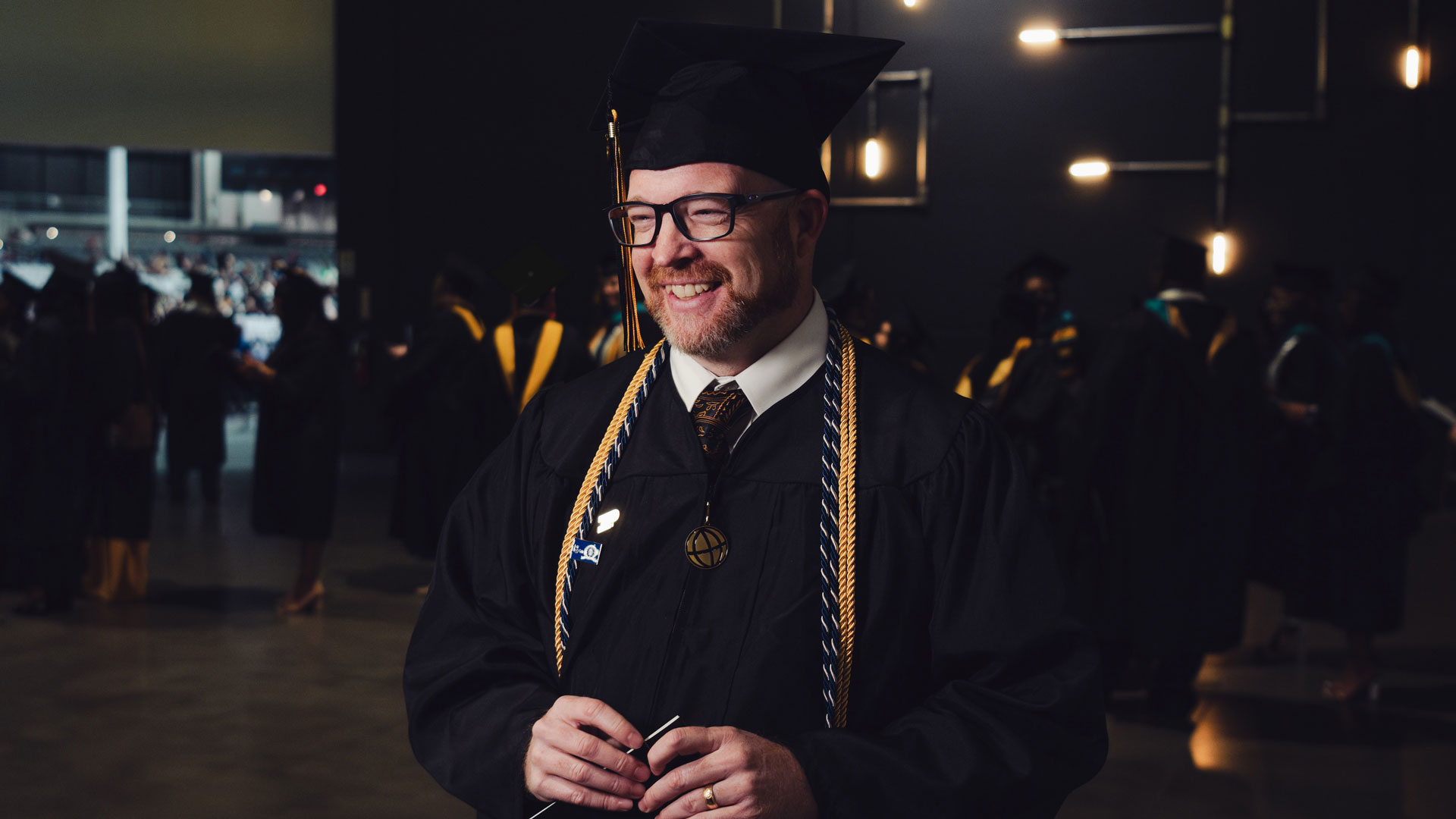 Craig Dockstader with a big smile at his in-person Purdue Global graduation.